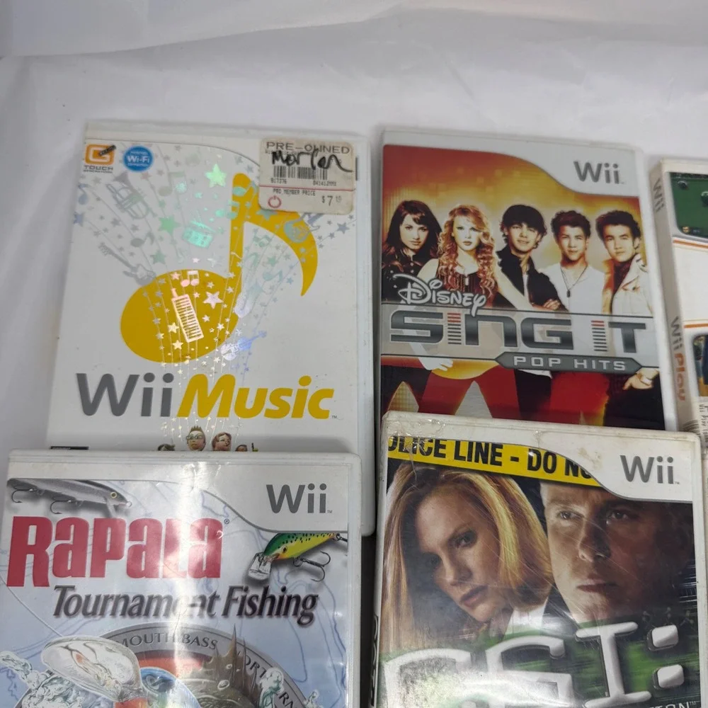 Nintendo Wii 7 Game Lot Wii Play Music Rapala CSI Disney Sing It Country Dance 2